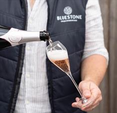 Bluestone sparkling rosé being poured into a glass