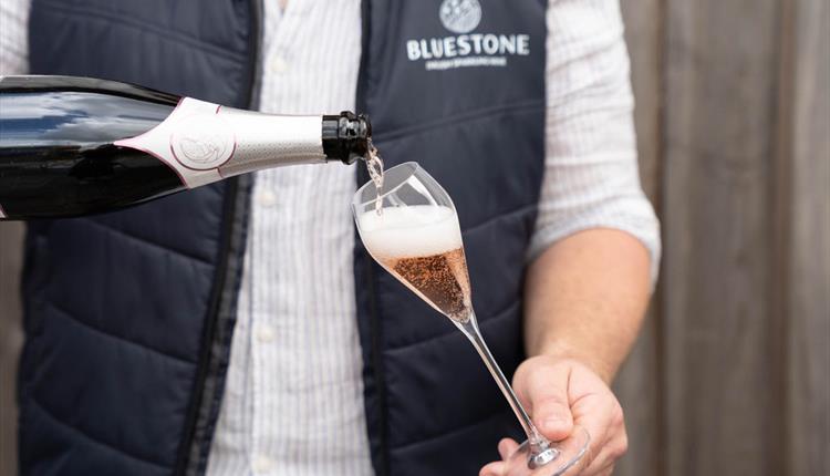 Bluestone sparkling rosé being poured into a glass